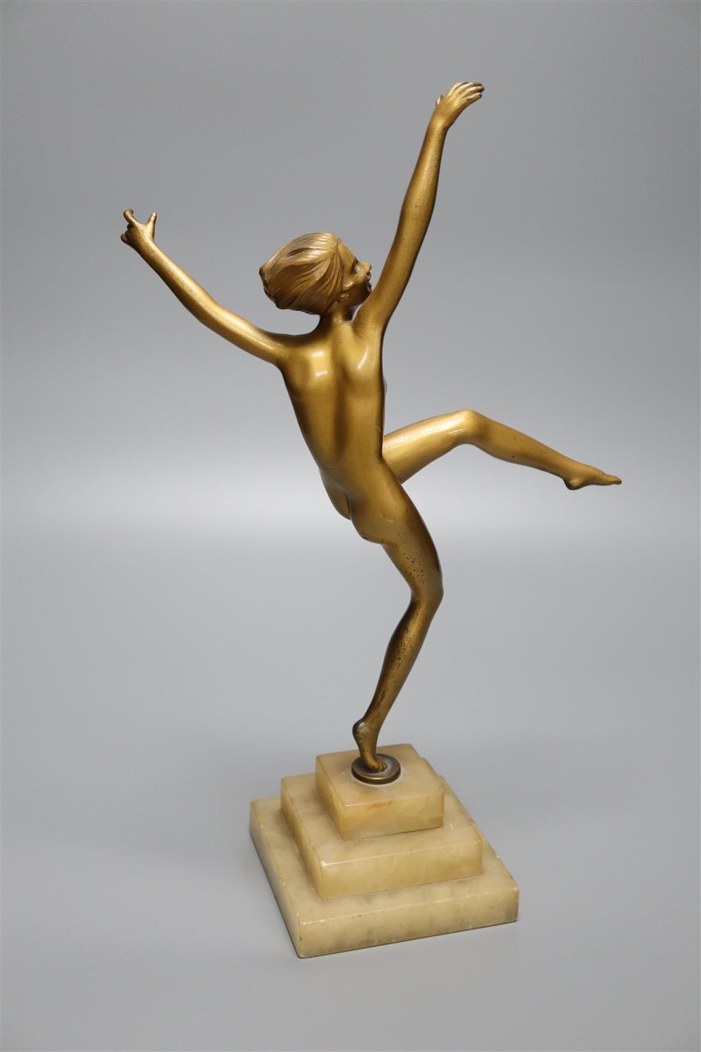 An Art Nouveau bronzed spelter nude dancer, on stepped square alabaster base, 38.5cm